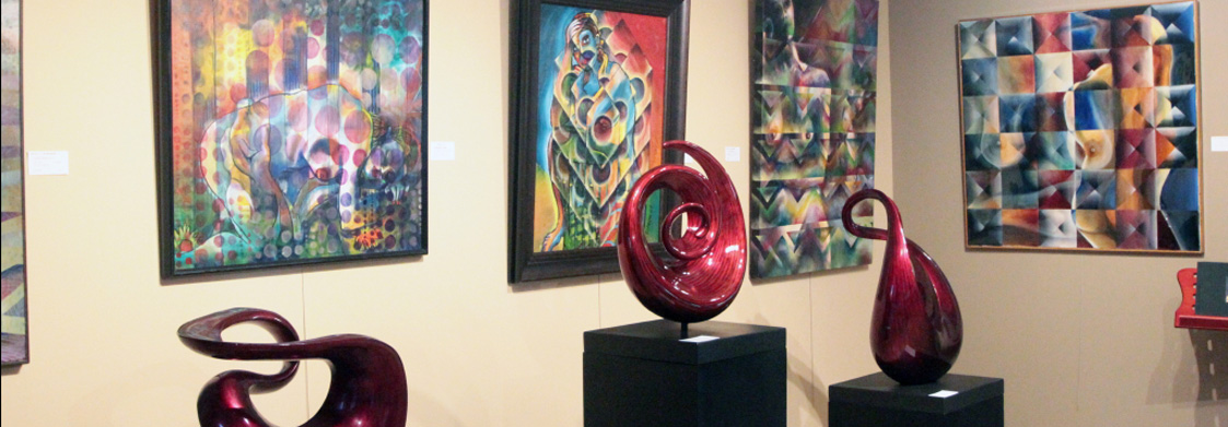 Gallery interior with contemporary art and burgundy sculptures