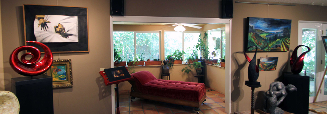 Gallery interior with bed installation and neon sculptures